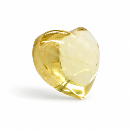 Side view of the natural citrine heart showing warm golden depth