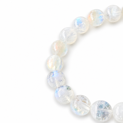 Pink-blue adularescence shifting across Madagascar Moonstone beads in angled light