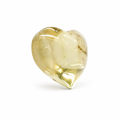 Rainbow citrine heart catching angled light to reveal full-spectrum prismatic effect