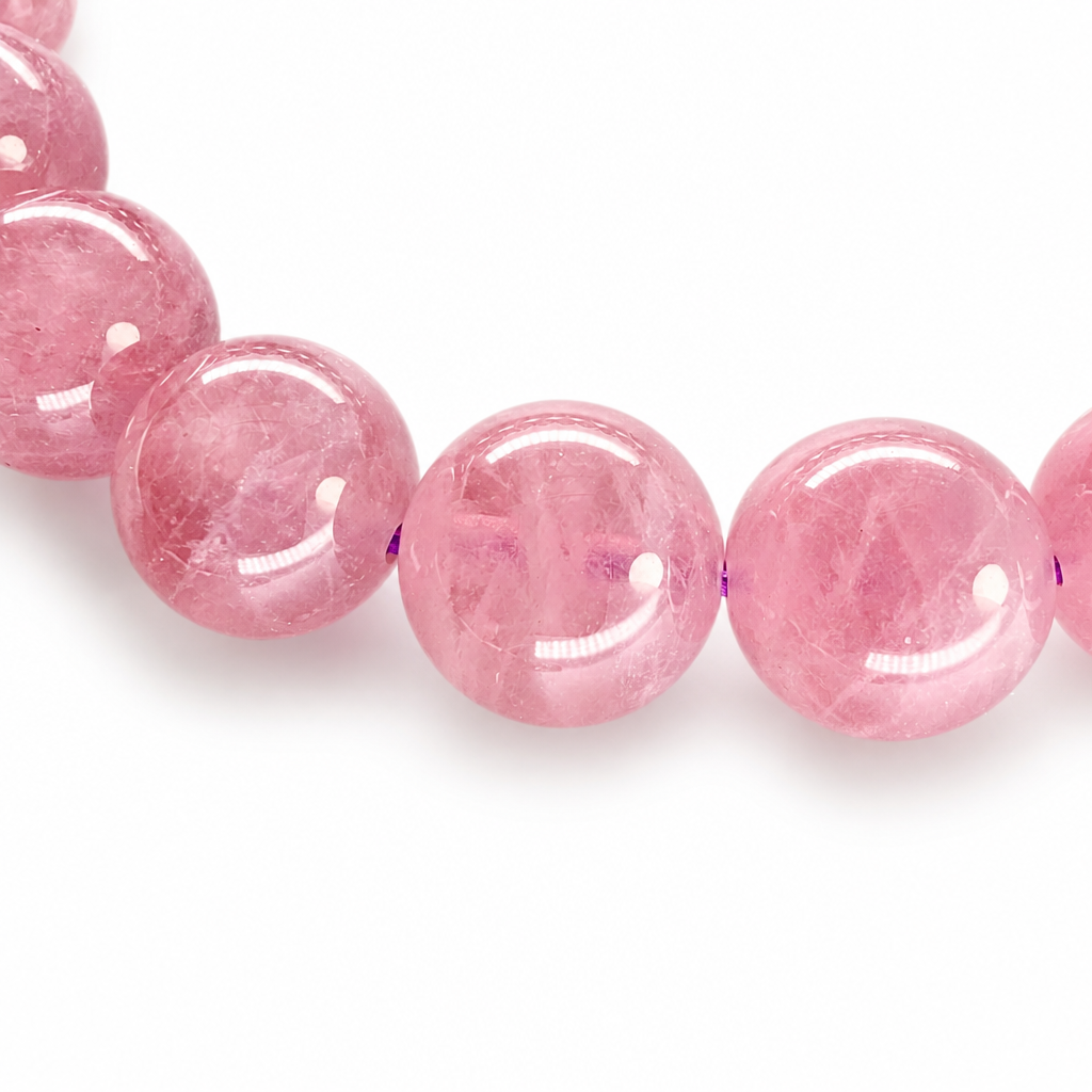 Star rose quartz bracelet coiled to show its cool purple-pink body colour