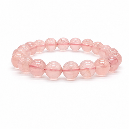 Bold 9.5mm rose quartz beads on a white background