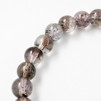 Black Super Seven Melody Stone fine bracelet as a grounding everyday crystal piece