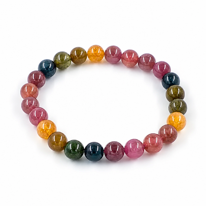 Rainbow Tourmaline bracelet with full-spectrum 7.5mm beads on a white surface