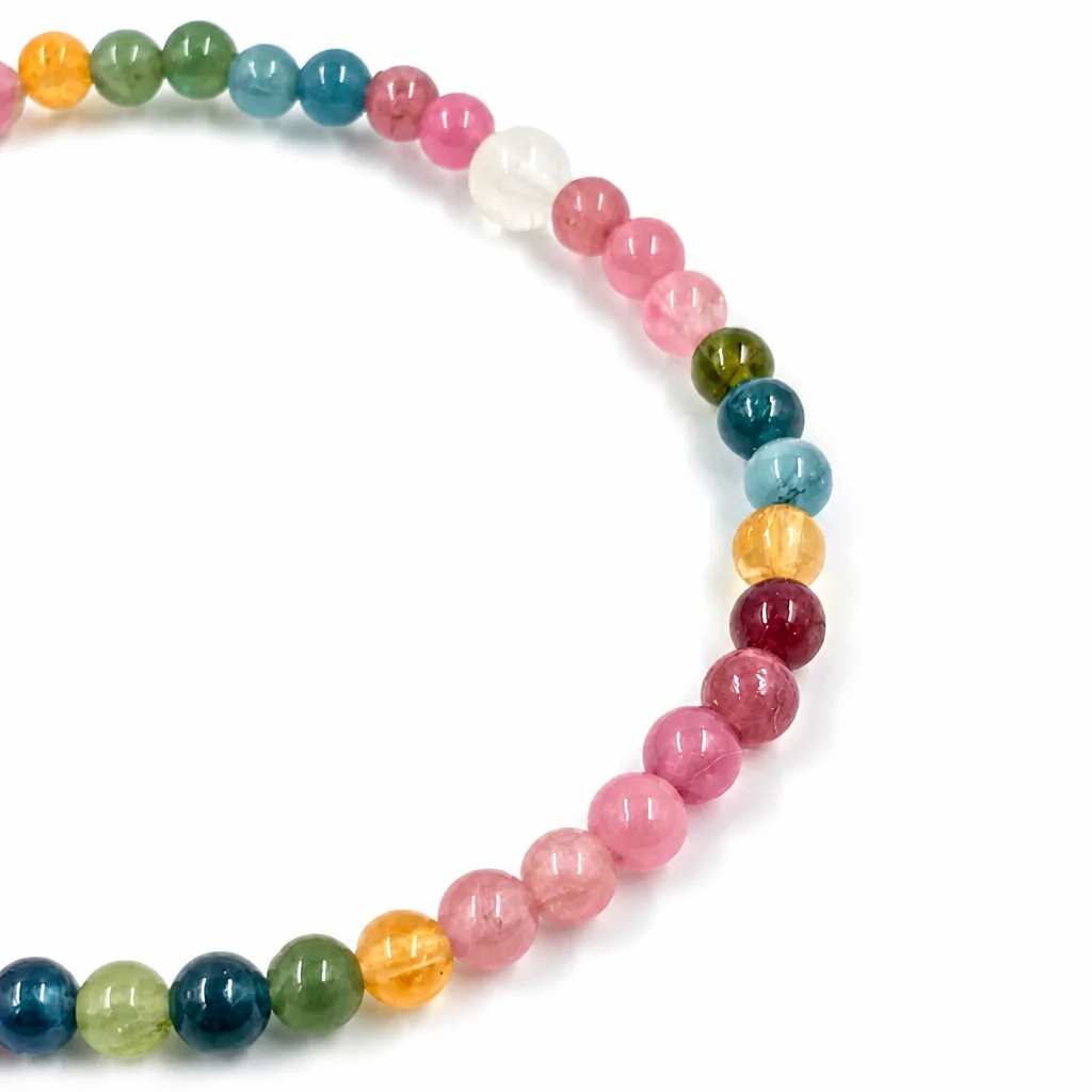 Detail of the hand-finished 9.1mm golden Pixiu charm on tourmaline bracelet