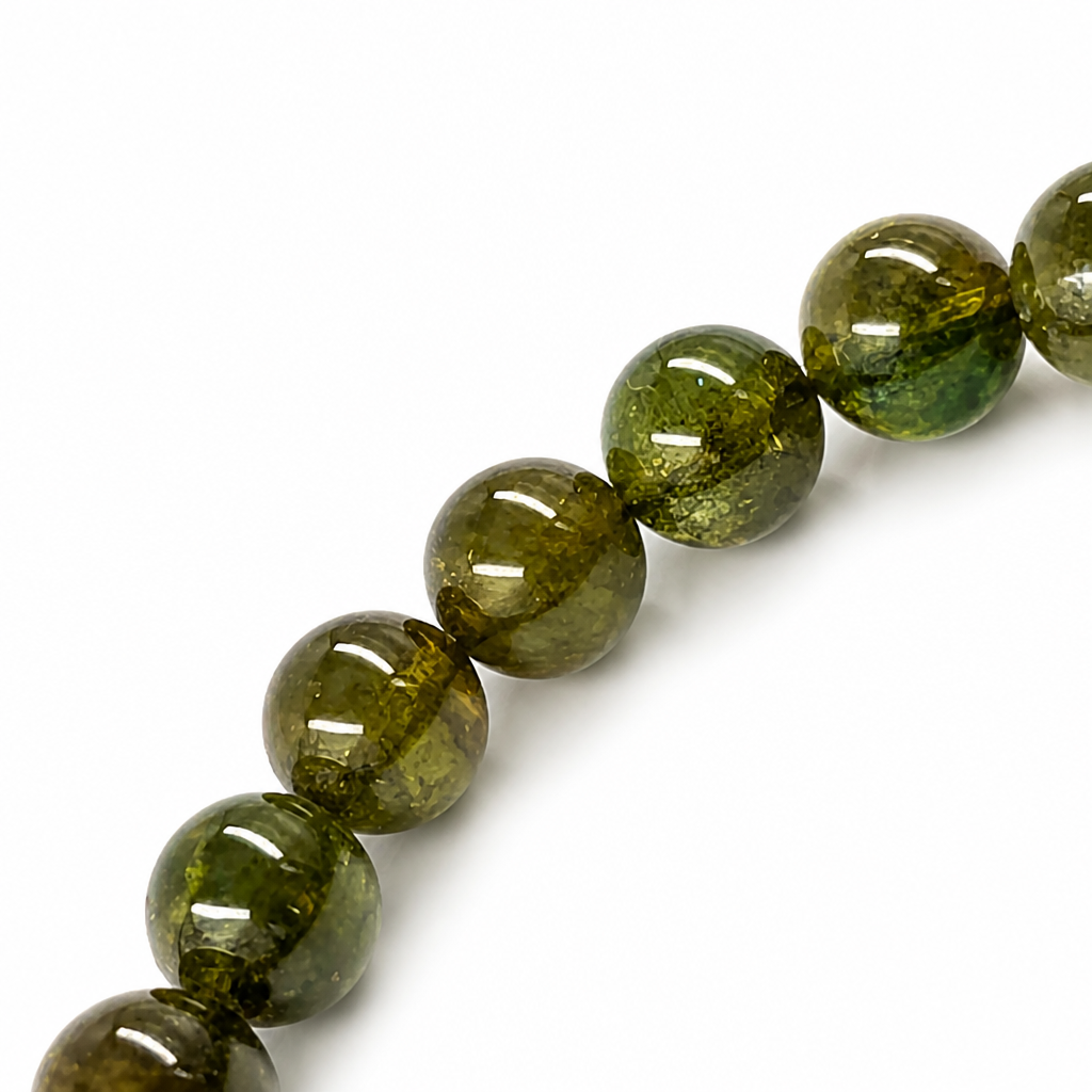 Deep leaf green to forest green colour range visible across verdelite beads