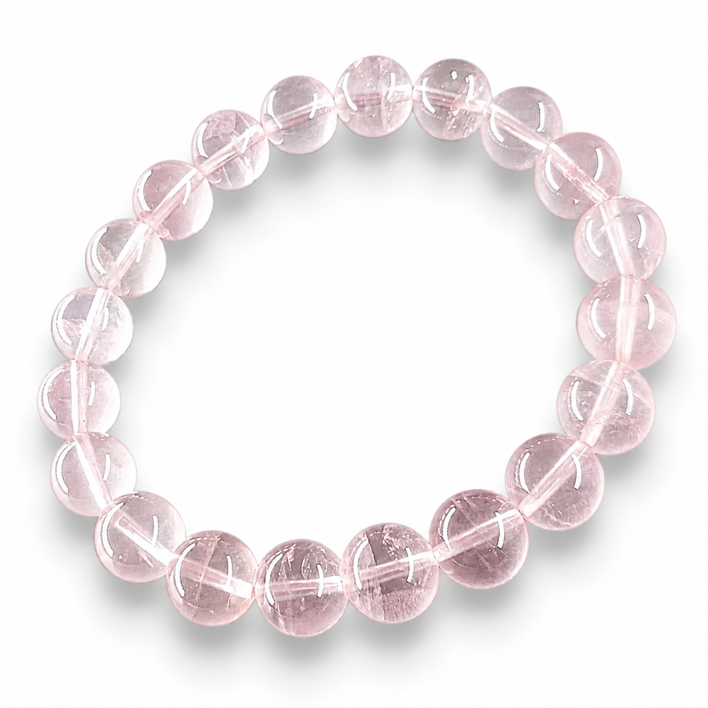 Close-up of soft clean milky-pink Madagascar Rose Quartz beads showing natural gentle luminosity