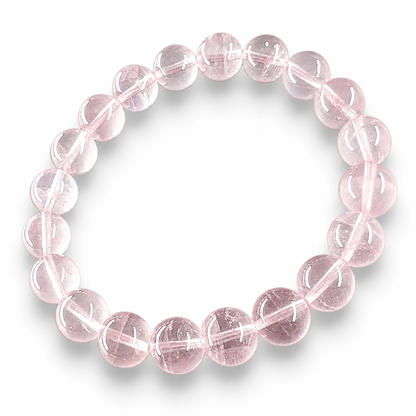 Close-up of soft clean milky-pink Madagascar Rose Quartz beads showing natural gentle luminosity