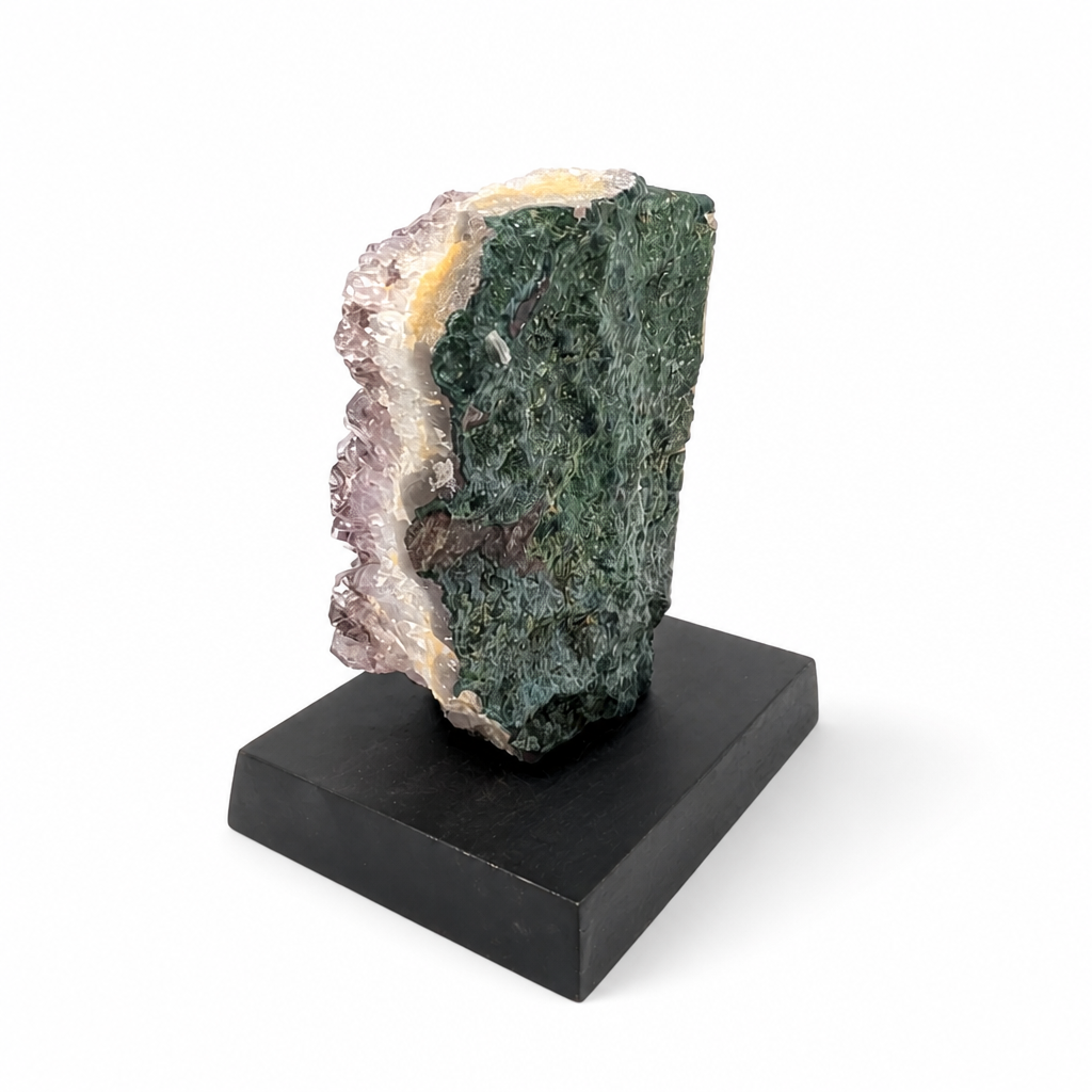 Black Goethite inclusions threading through a natural amethyst crystal spire