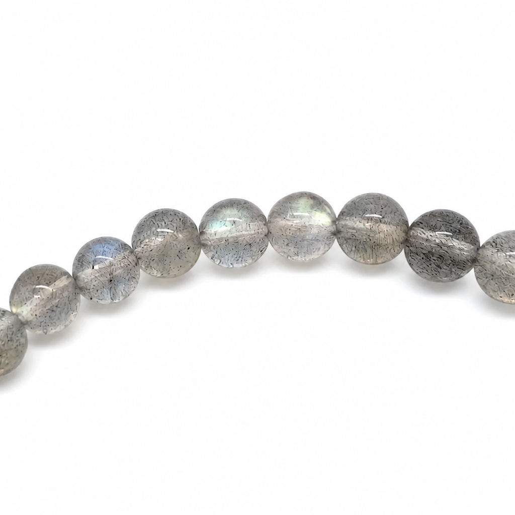 Labradorescence rippling across a labradorite bead