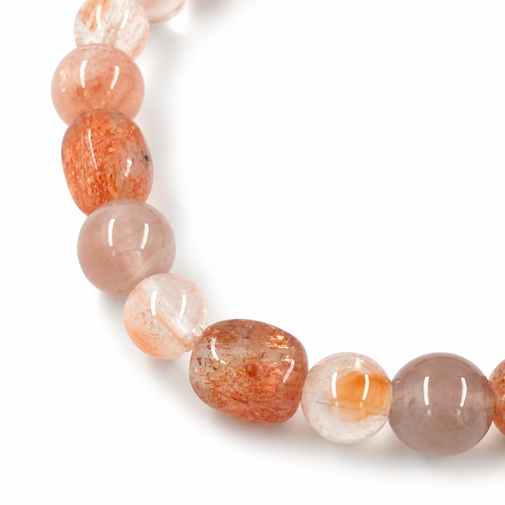 Side view of the red-orange sunstone and rutilated quartz two-stone bracelet