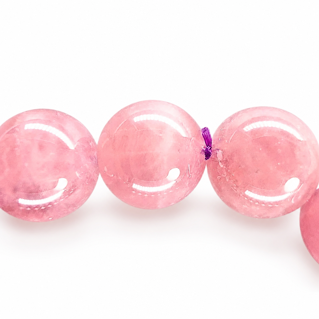 Full circle of the violet star rose quartz bracelet on a pale background
