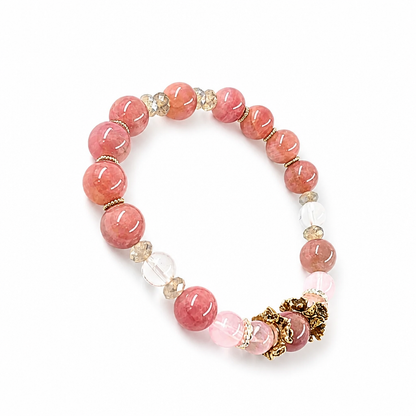 Gold-and-silver floral charm between pale quartz beads