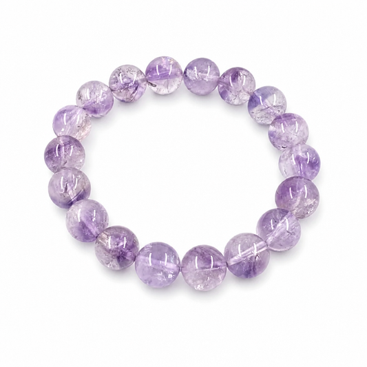Super Seven Melody Stone bracelet with deep violet and multi-mineral inclusions on white