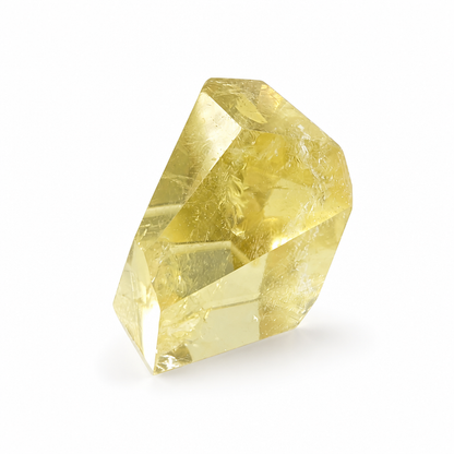 Honey-gold Brazilian Citrine point specimen resting on a pale surface