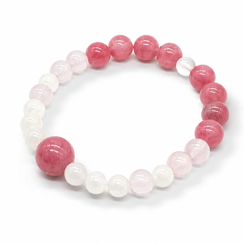 Lunar Rescue bracelet with warm rose-pink rhodonite and milky Madagascar moonstone on white