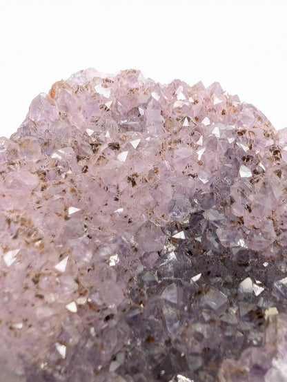 Natural symbiotic mineral inclusions on the gradient amethyst cluster base