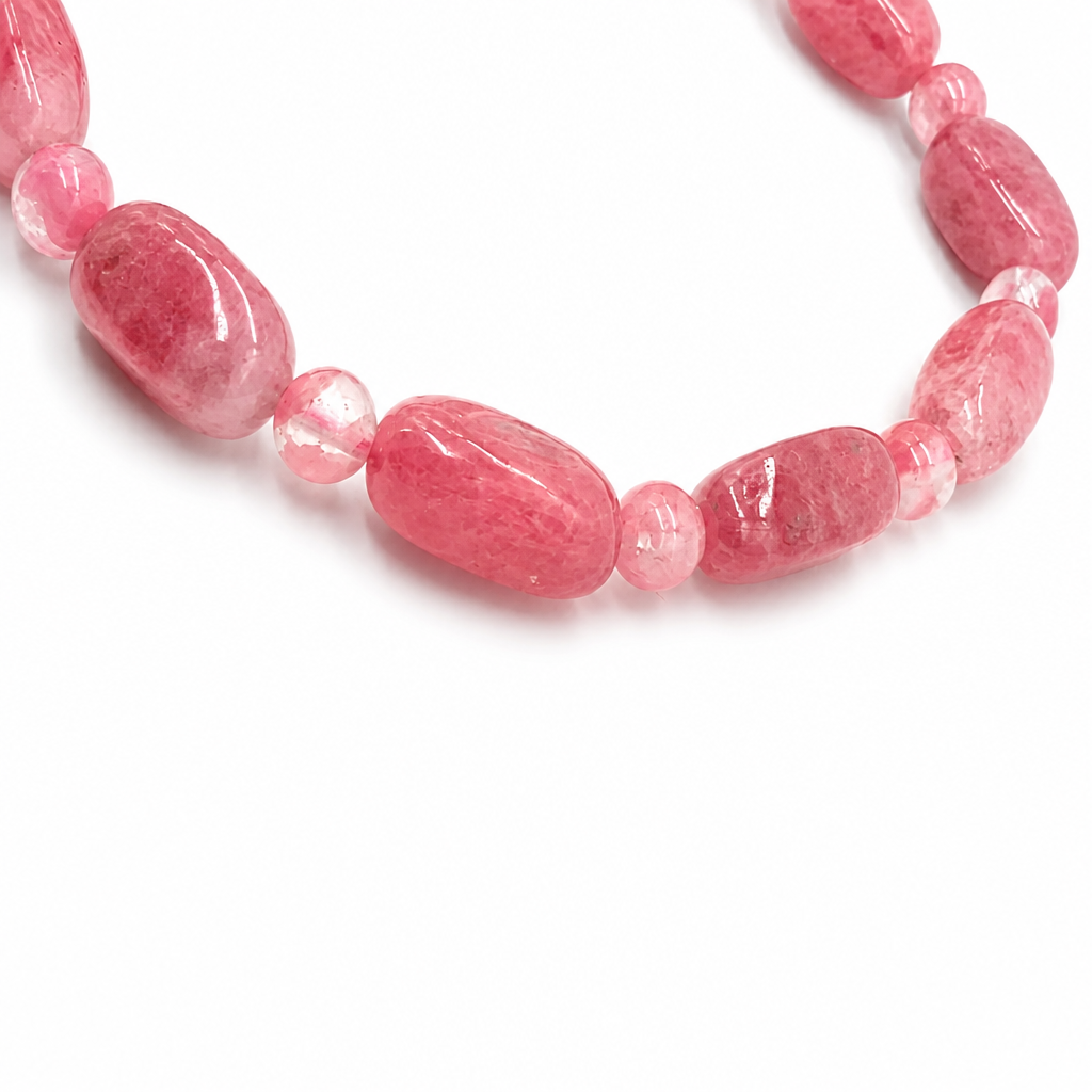 Rose-pink rhodonite with dramatic black veining detail