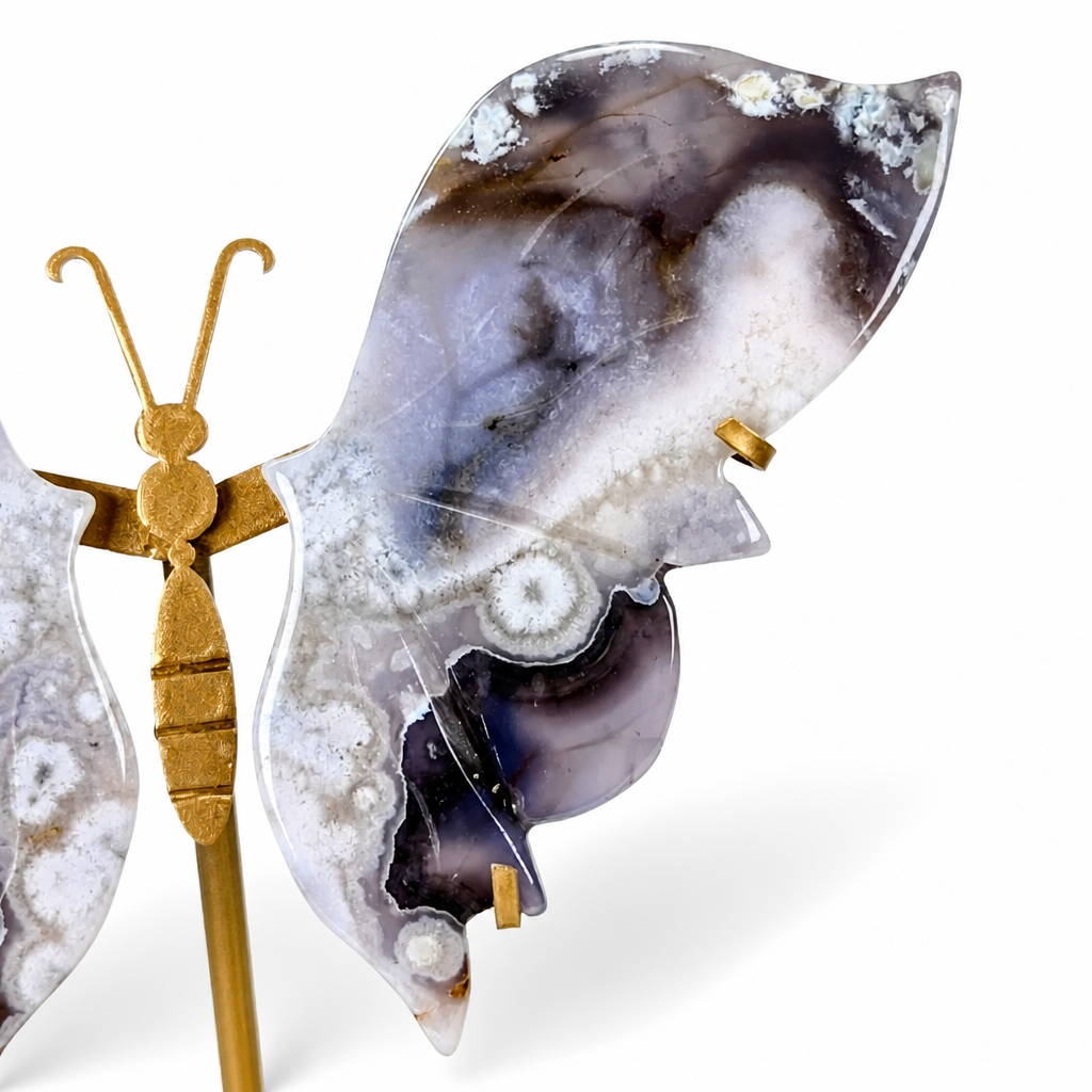 Hand-carved blue agate butterfly wings with indigo and white floral inclusions