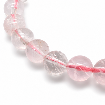 Rare jelly-grade Madagascar Rose Quartz bracelet showing collector-quality bead transparency