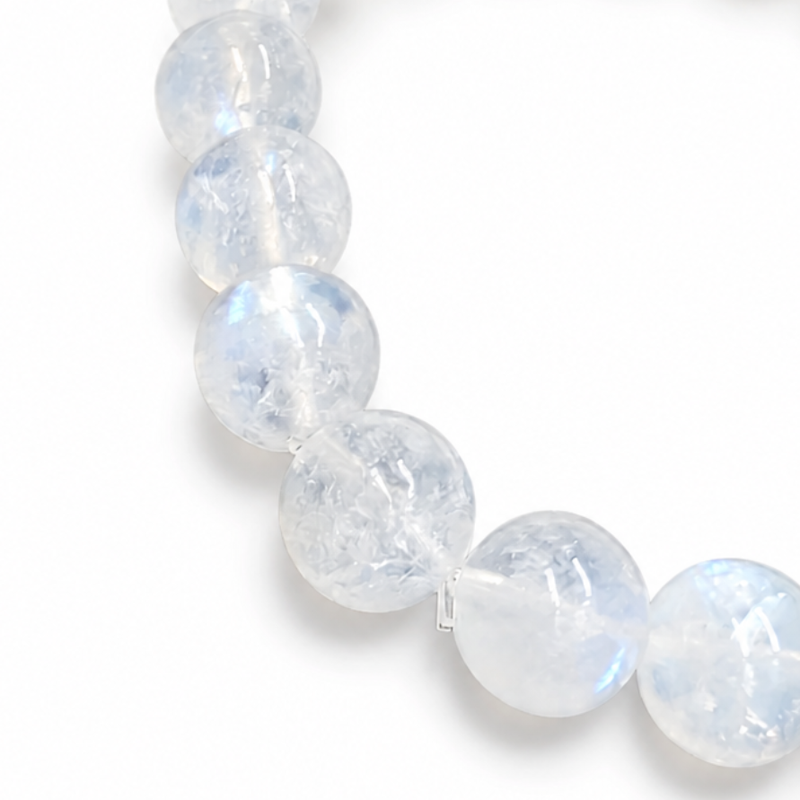 Indian Moonstone bracelet resting flat showing even milky-opaque bead selection across all three styles