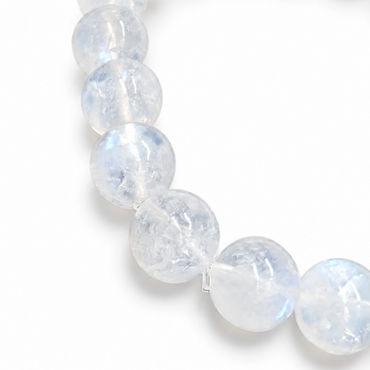 Indian Moonstone bracelet resting flat showing even milky-opaque bead selection across all three styles