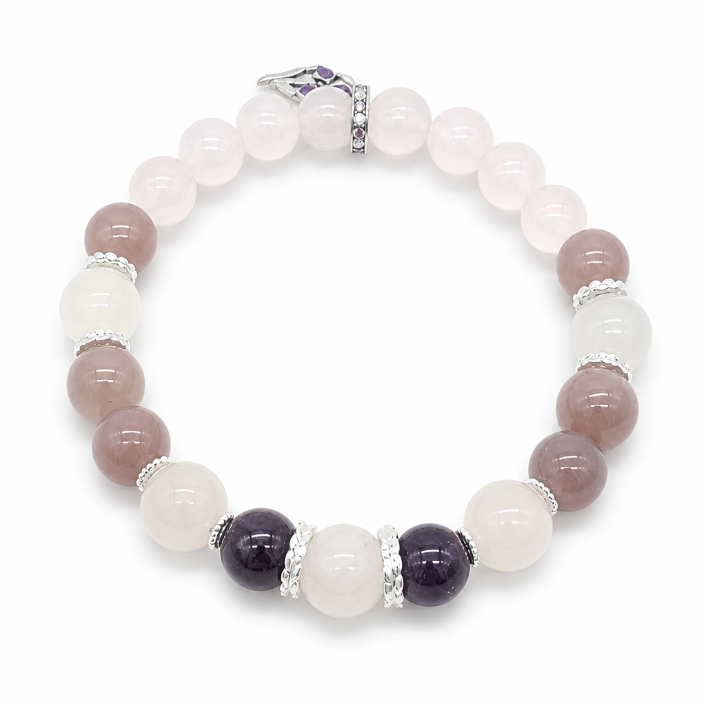 Silver filigree spacers between amethyst and rose quartz beads on the Amethyst Rose Serenity bracelet