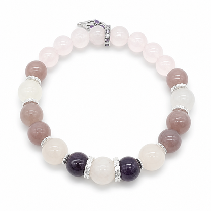 Silver filigree spacers between amethyst and rose quartz beads on the Amethyst Rose Serenity bracelet