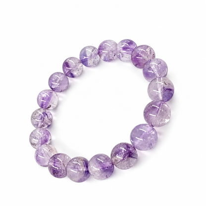 Full bracelet circle of Super Seven Melody Stone showing violet smoky and gold threads