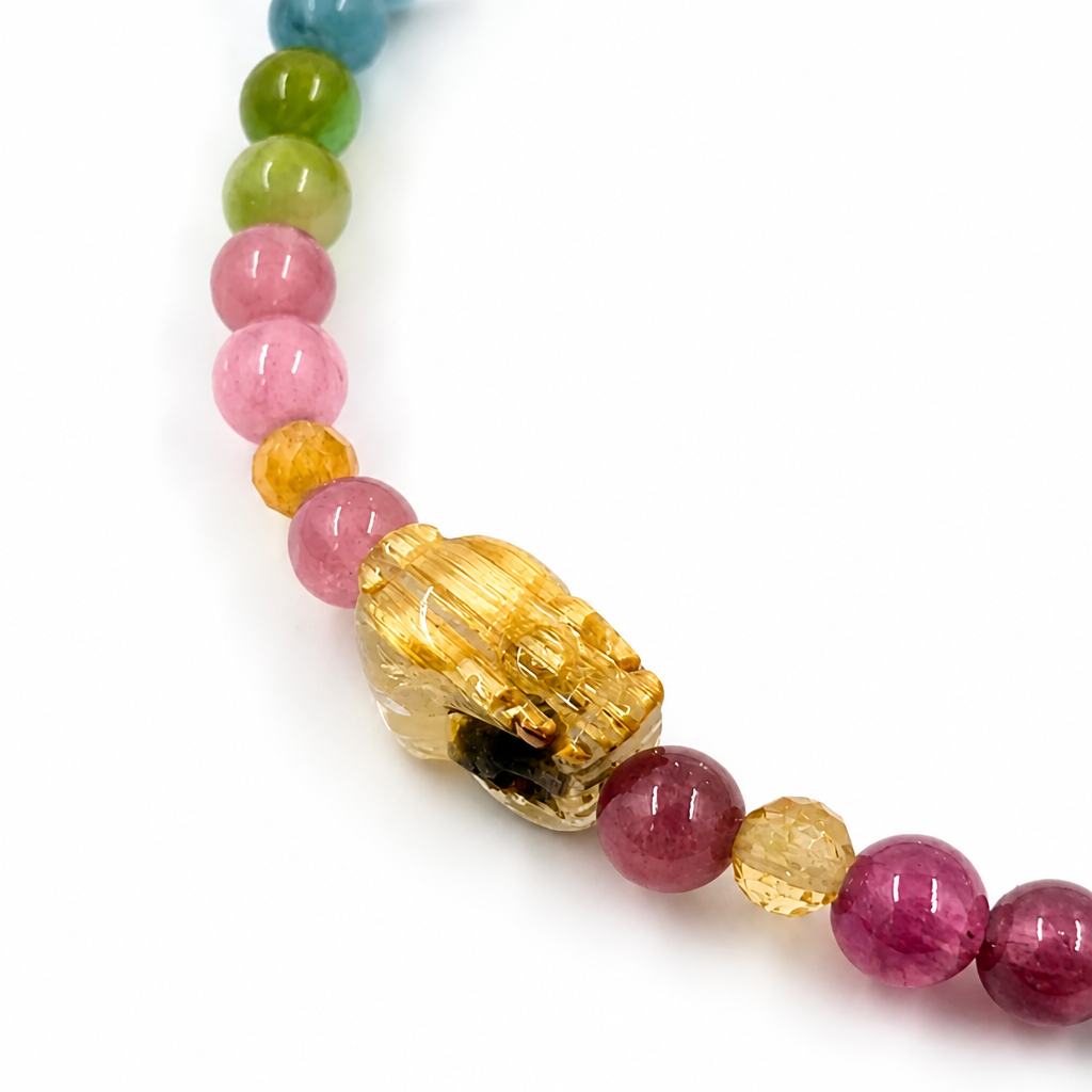 Pixiu Tourmaline Rainbow bracelet worn on the wrist showing charm and bead colour