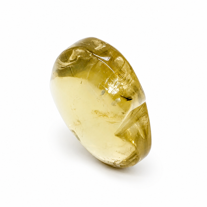 Citrine heart specimen scattering rainbow light across a white background