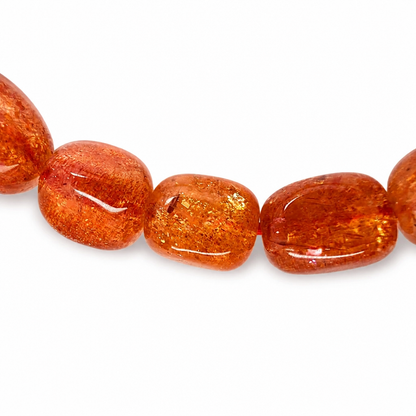 6 to 7mm sunstone beads with copper shimmer on elastic cord