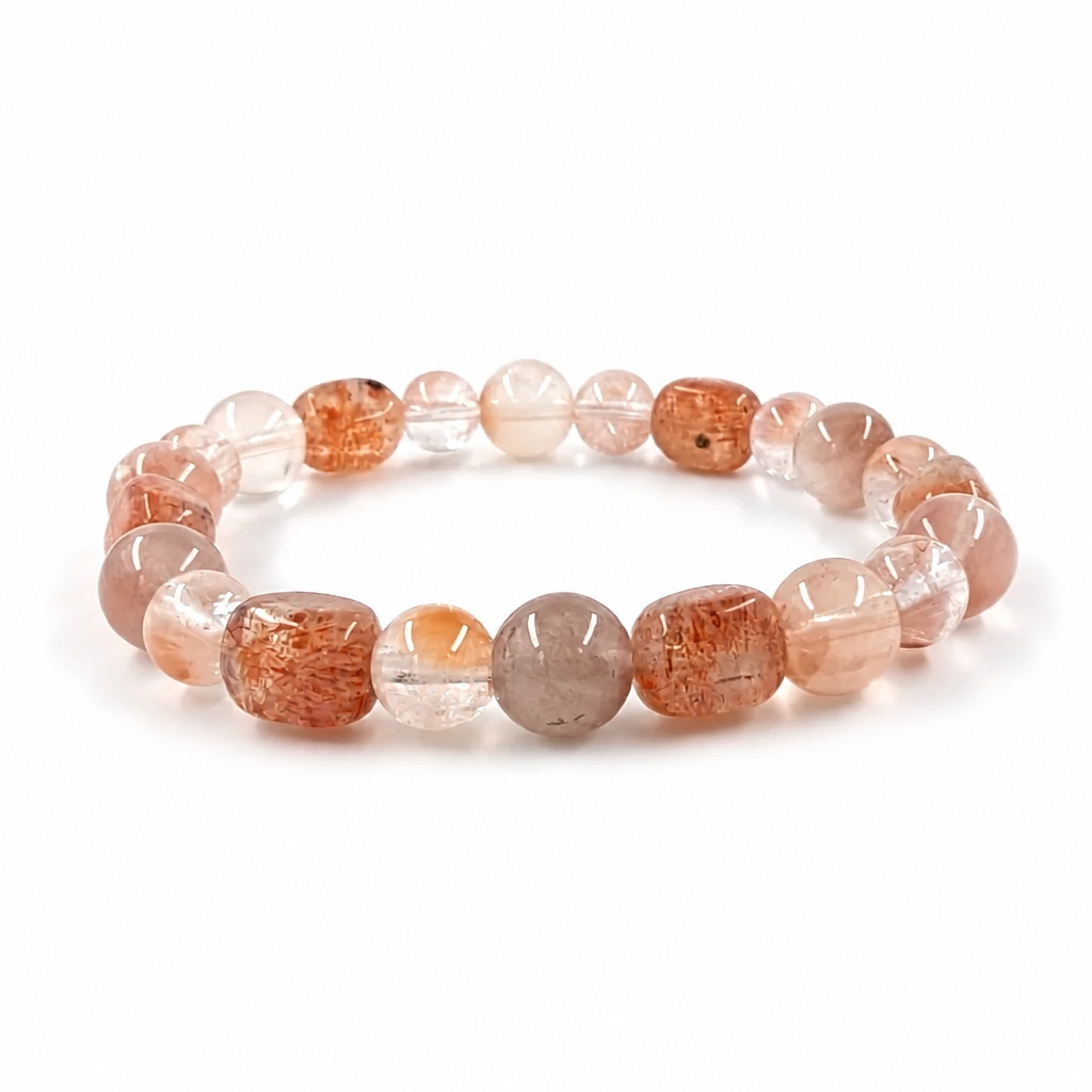 Full bracelet circle showing red-orange sunstone and rabbit hair quartz bead pairing