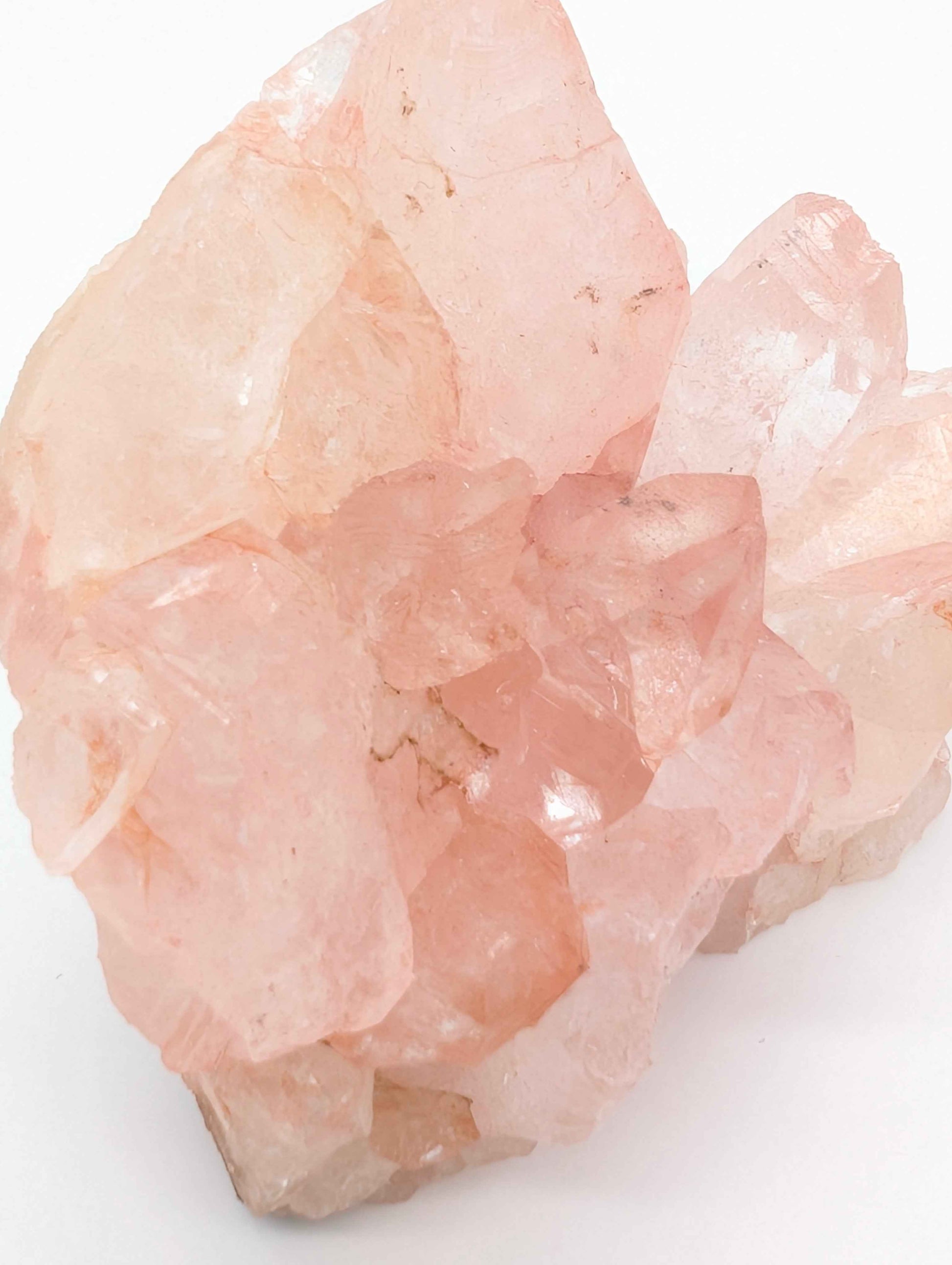 Large Pink Samadhi Quartz cluster displayed on a shelf for home decor