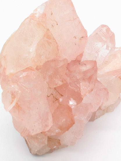 Large Pink Samadhi Quartz cluster displayed on a shelf for home decor