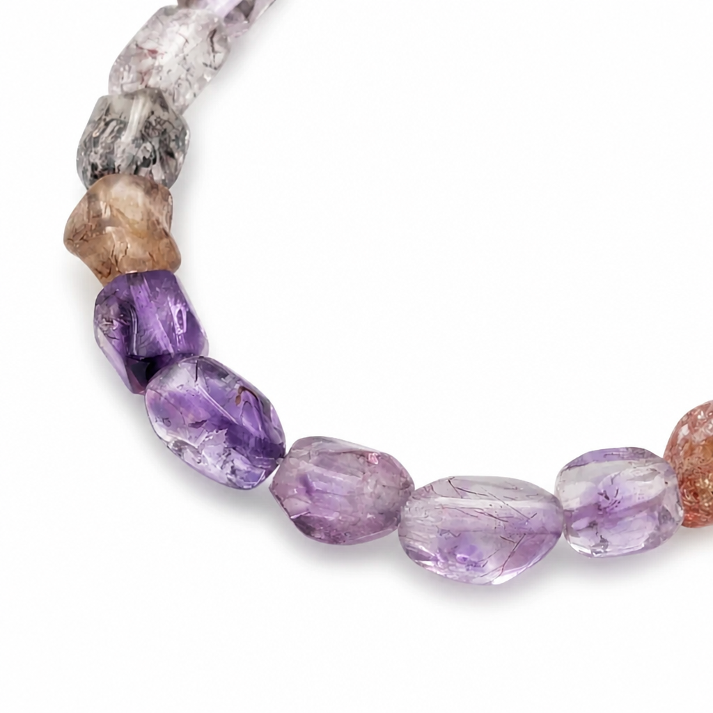 Side view of the faceted Super Seven bracelet showing bead depth and clarity