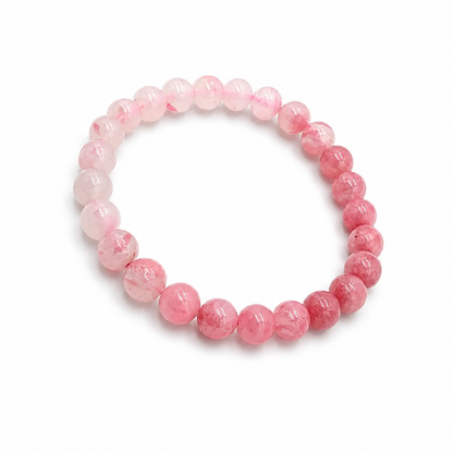Rhodonite Gradient bracelet showing hand-arranged dusty pink to deep rose ombré on white surface
