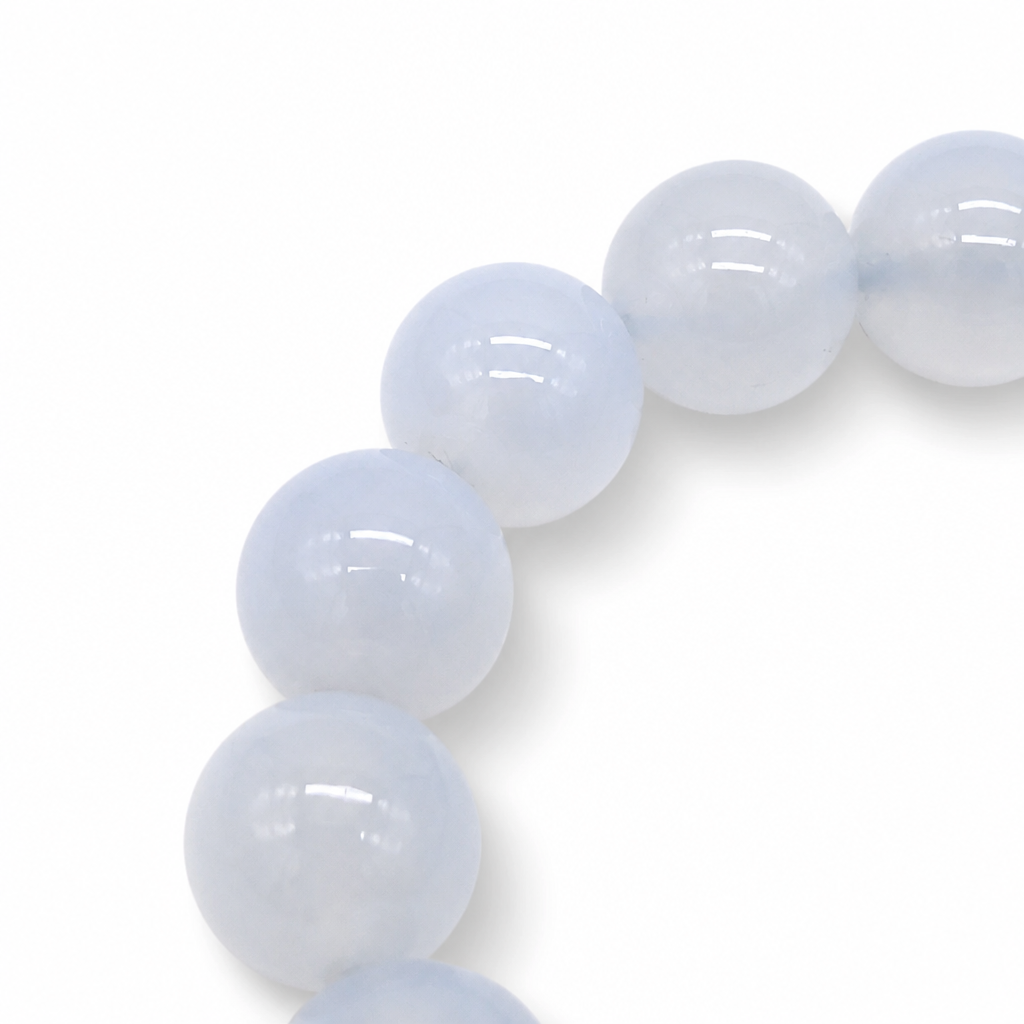 Blue Chalcedony bracelet resting flat showing cool and warm blue variant bead tones