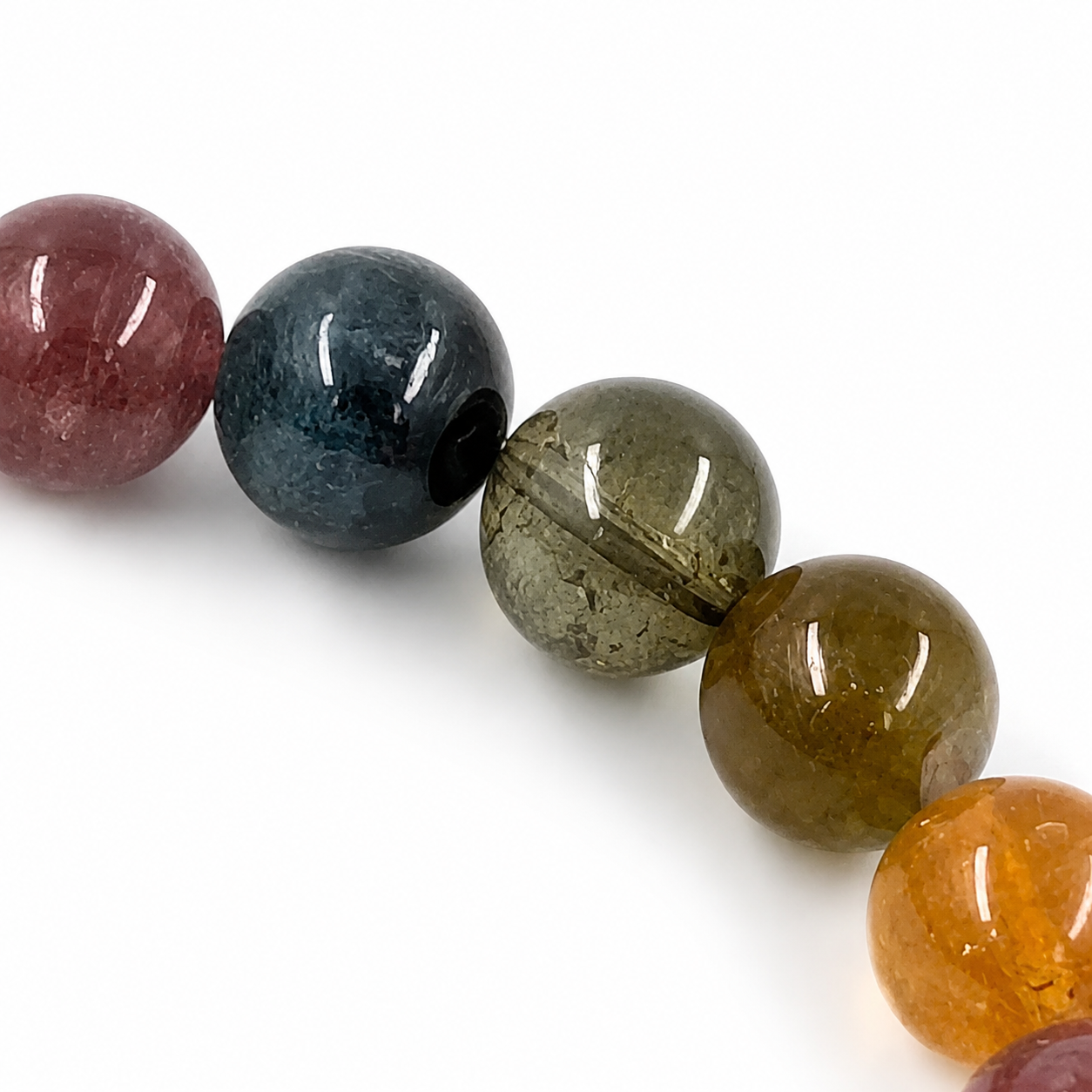 Rainbow Tourmaline bracelet resting flat showing even colour transitions between beads
