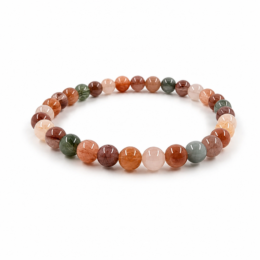 Rabbit Hair Quartz bracelet with rose-gold rutile inclusions on a white surface