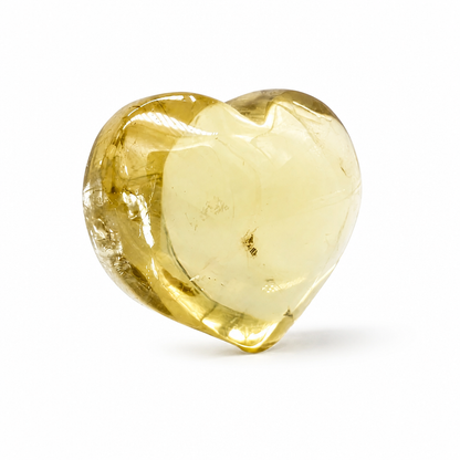 Honey Citrine heart specimen with deep gold tones on a white surface