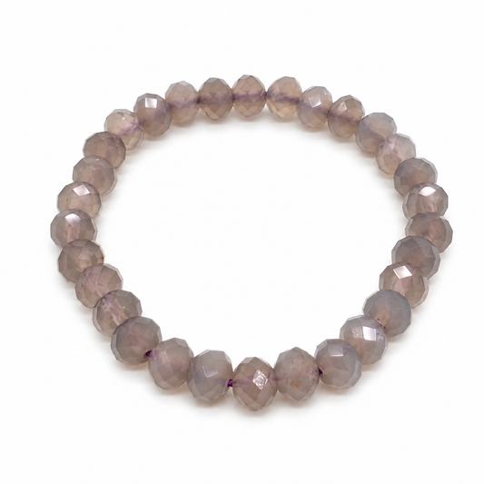 Close-up of purple chalcedony beads with smooth waxy lustre