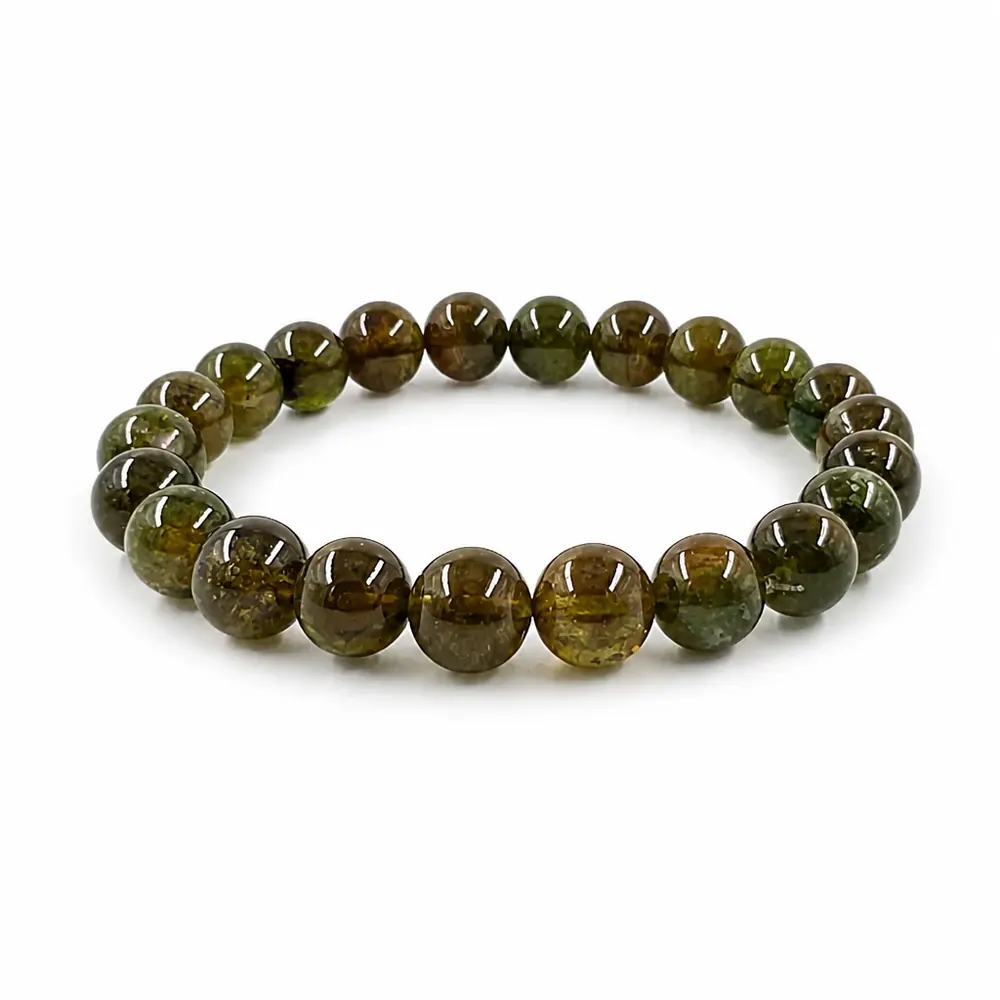 Green tourmaline bracelet with deep green beads on a white surface