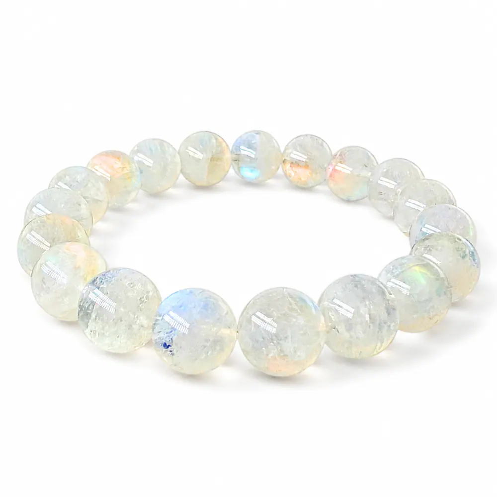 Close-up of rosy-pink adularescence drifting across a 10mm Madagascar Moonstone bead