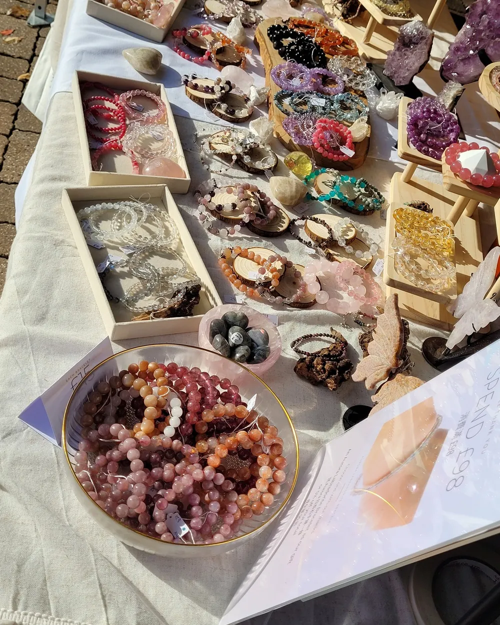 Trays of handmade natural crystal bracelets